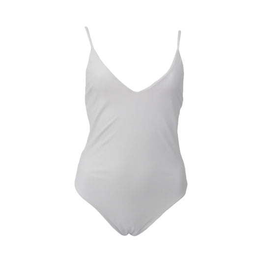 White simplistic one piece swimsuit with a plunging v neck and skinny straps. It has high cut legs with cheeky coverage and a low back. The back side has 4 skinny straps to elevate its simplicity.